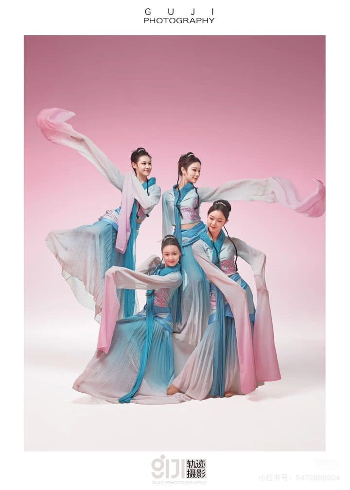 Dancers in ceremonial costume at a wedding banquet