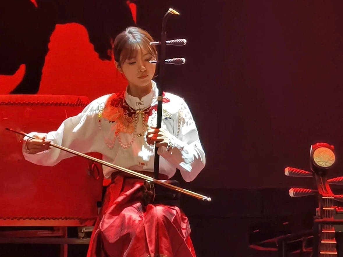 Erhu artist in red costume