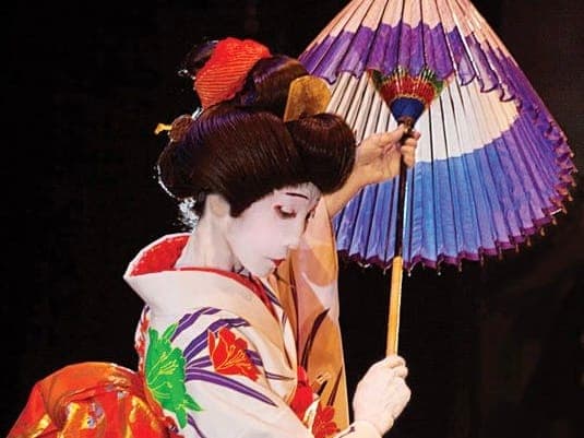 Parasol dancer in costume