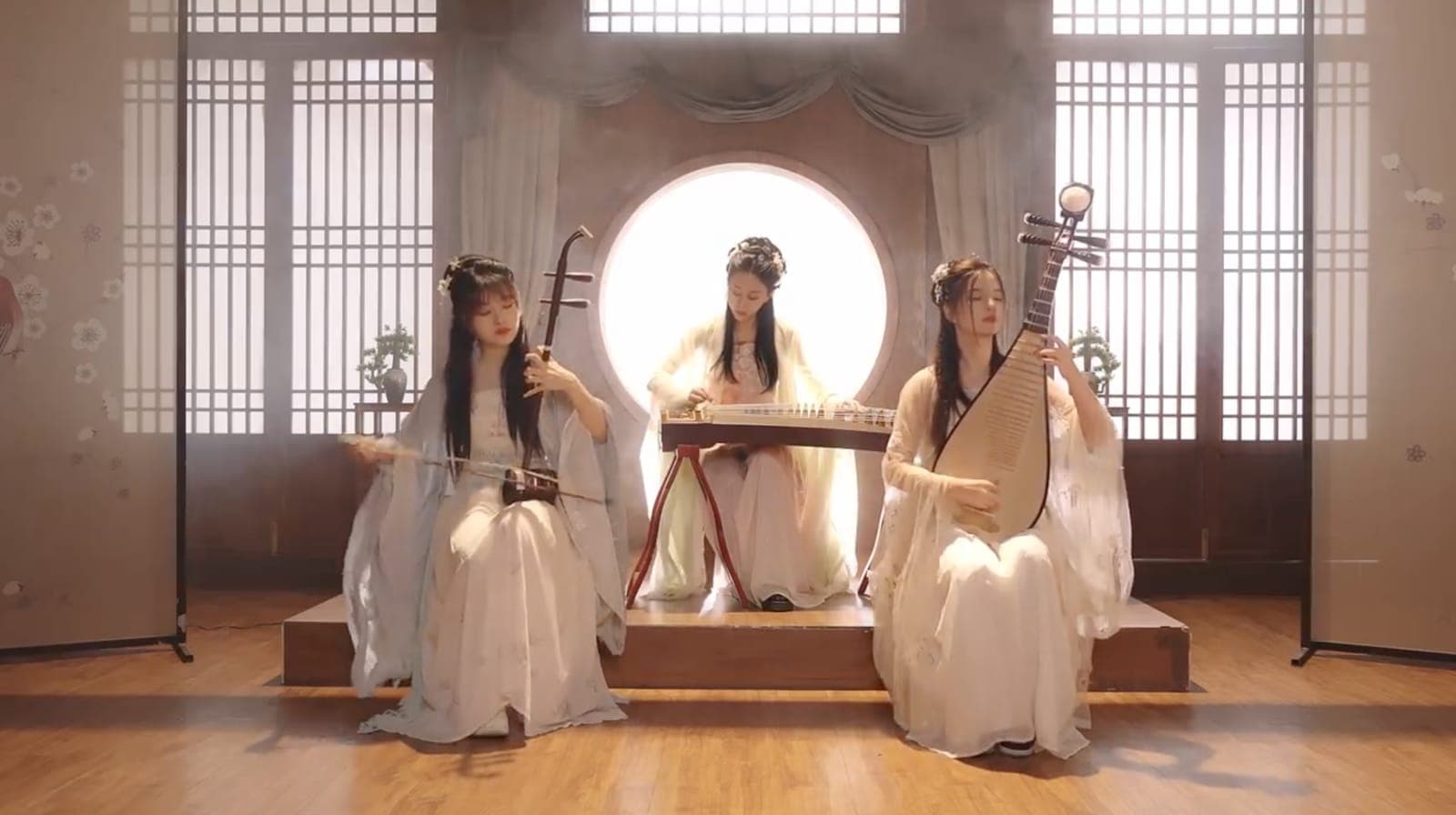 Three artists playing Guzheng, Erhu and Pipa